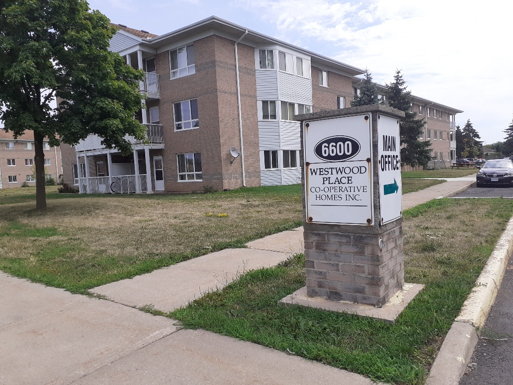 Exterior of Westwood Place with a sign that reads 6600 Westwood Place Co-operative Homes Inc